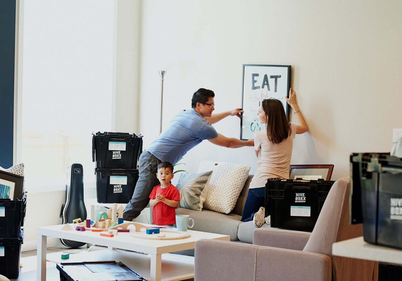 A couple unpacks boxes in their new home