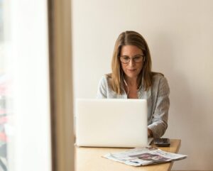 Woman working on laptop in an office