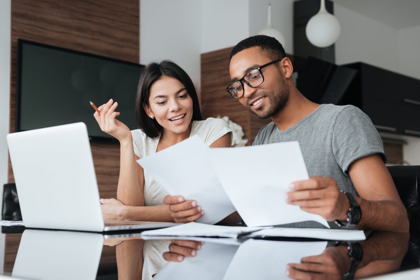 Coworkers reviewing documents in an office environment