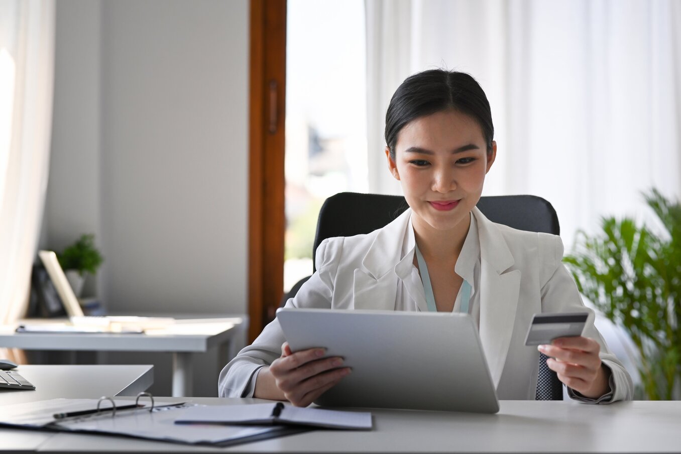 Businesswoman holding a credit card