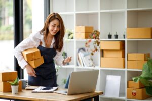 Female entrepreneur holding boxes