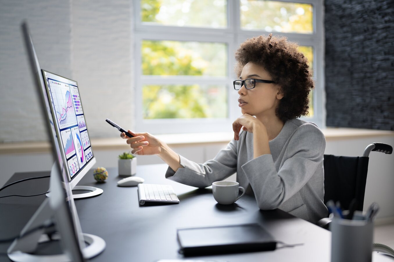 African American Business Data Analyst Woman Using Computer