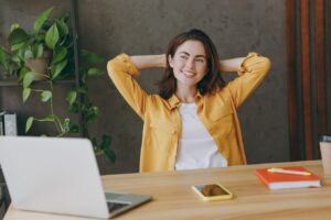 Woman in yellow taking a break from work
