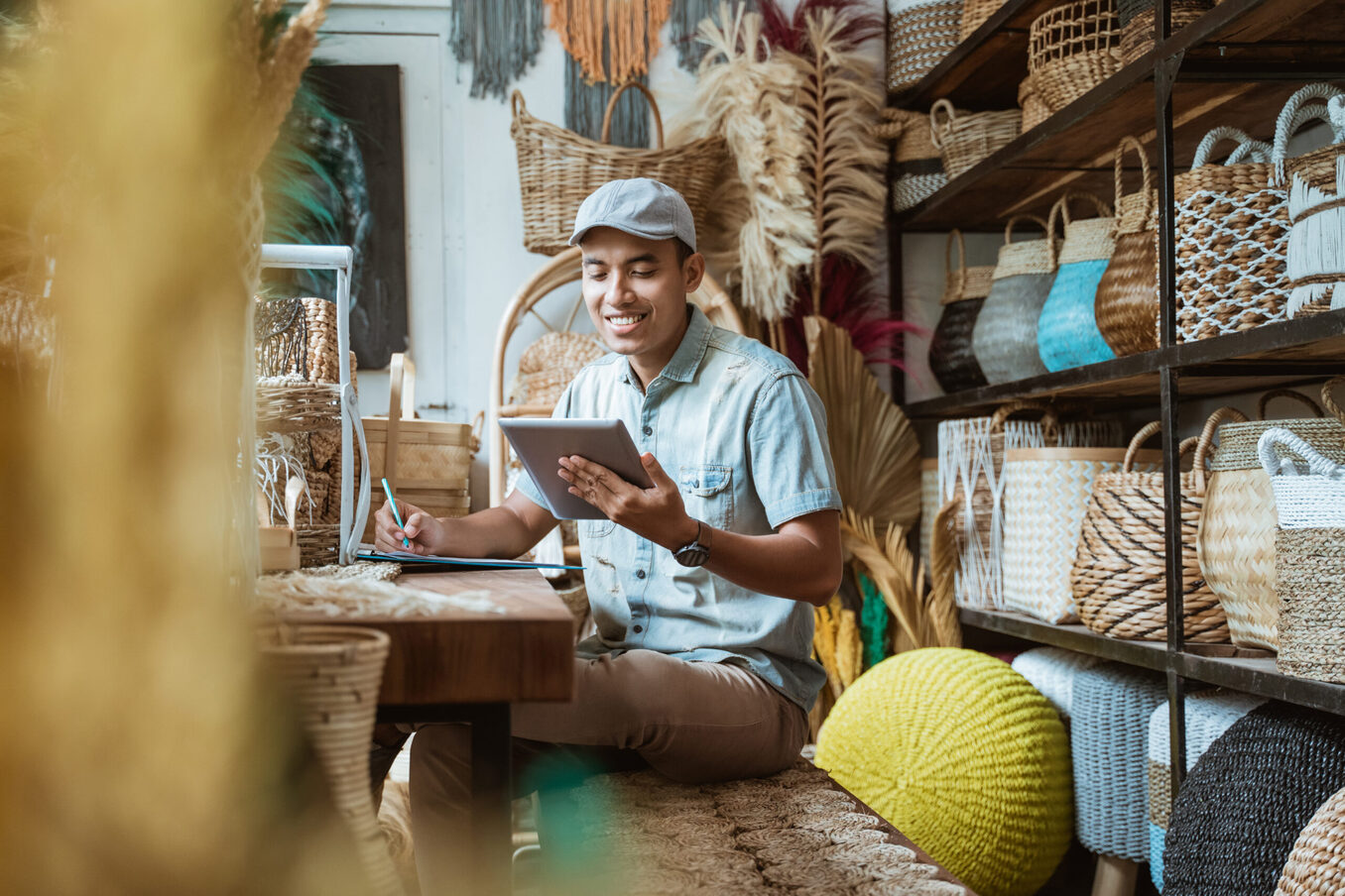 Shop owner taking notes in store