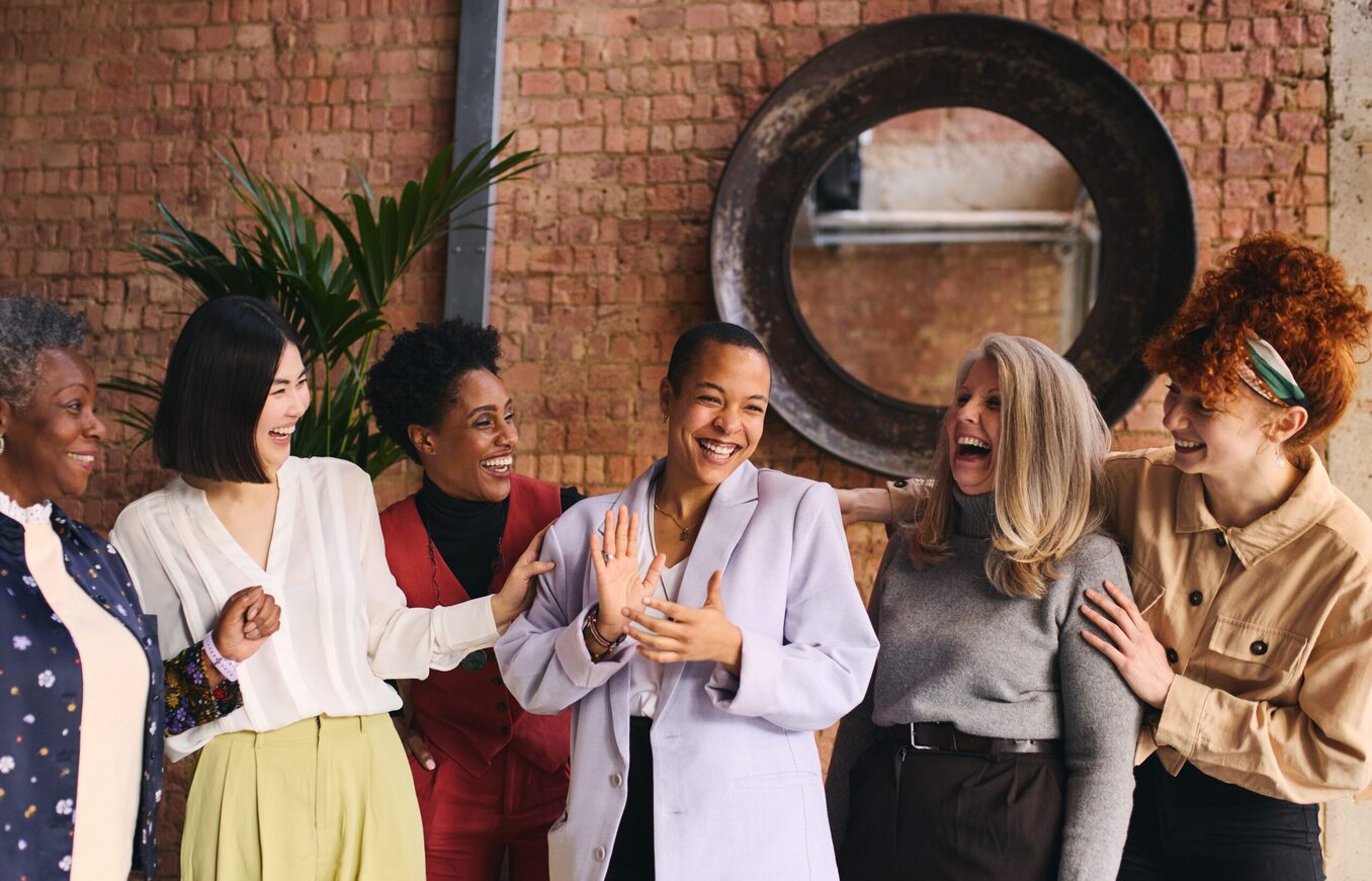 International women's day portrait of cheerful multiethnic mixed age range