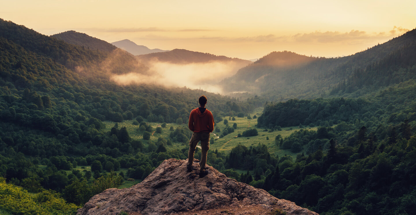 Man on top of a mountain