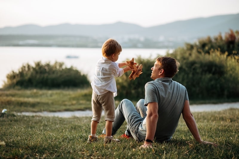 Father and son playing