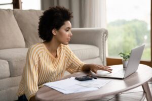 Woman using laptop at home