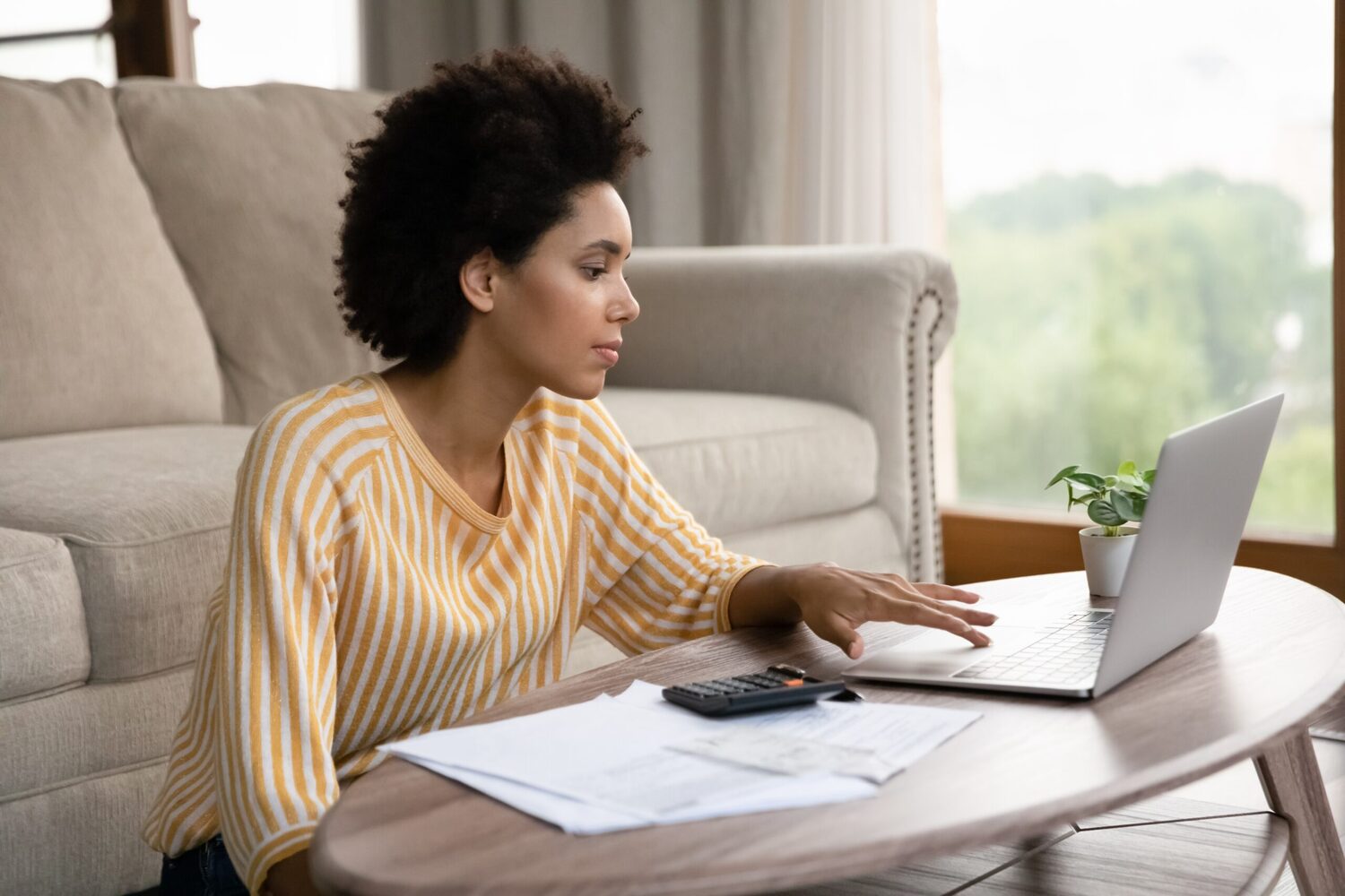 Woman using laptop at home