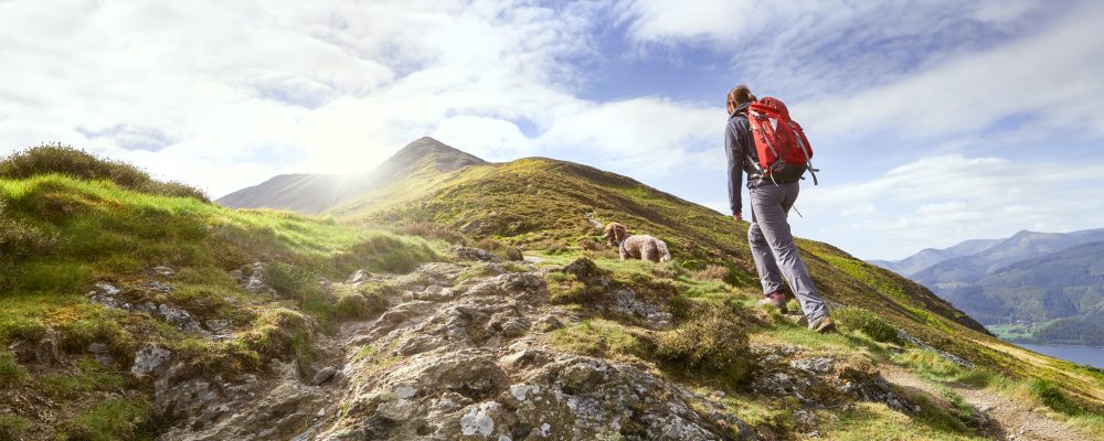 A,Hiker,Walking,Up,A,Mountain,Ridge,,The,Edge,,Towards