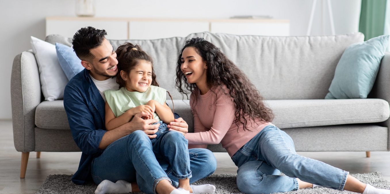 Middle,Eastern,Parents,Having,Fun,With,Their,Little,Daughter,At