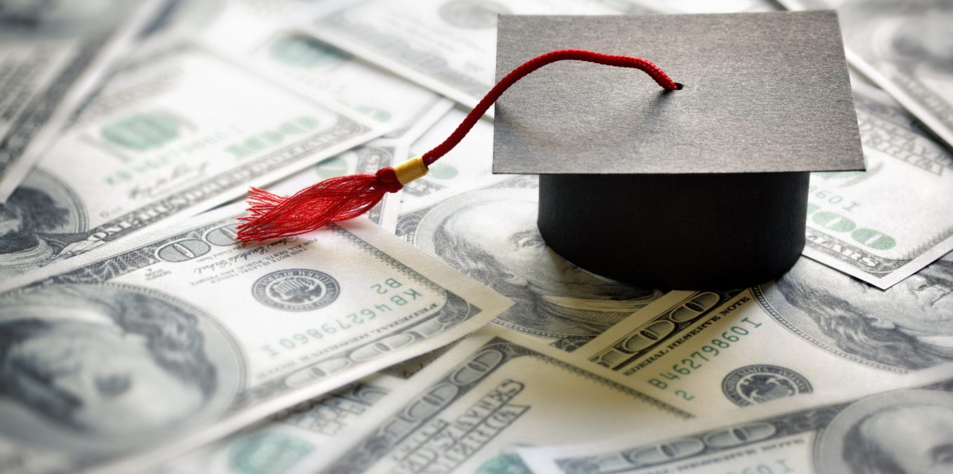 Graduation,Mortar,Board,Cap,On,One,Hundred,Dollar,Bills,Concept