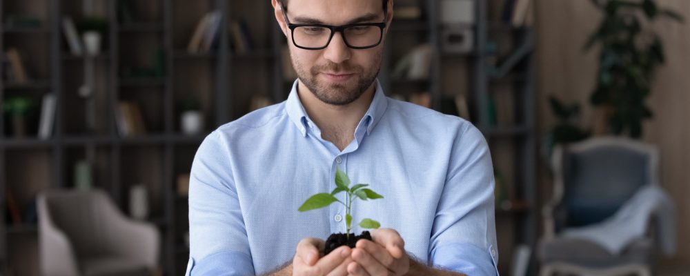 Happy,Young,Businessman,Hold,Soil,Green,Plant,Think,Plan