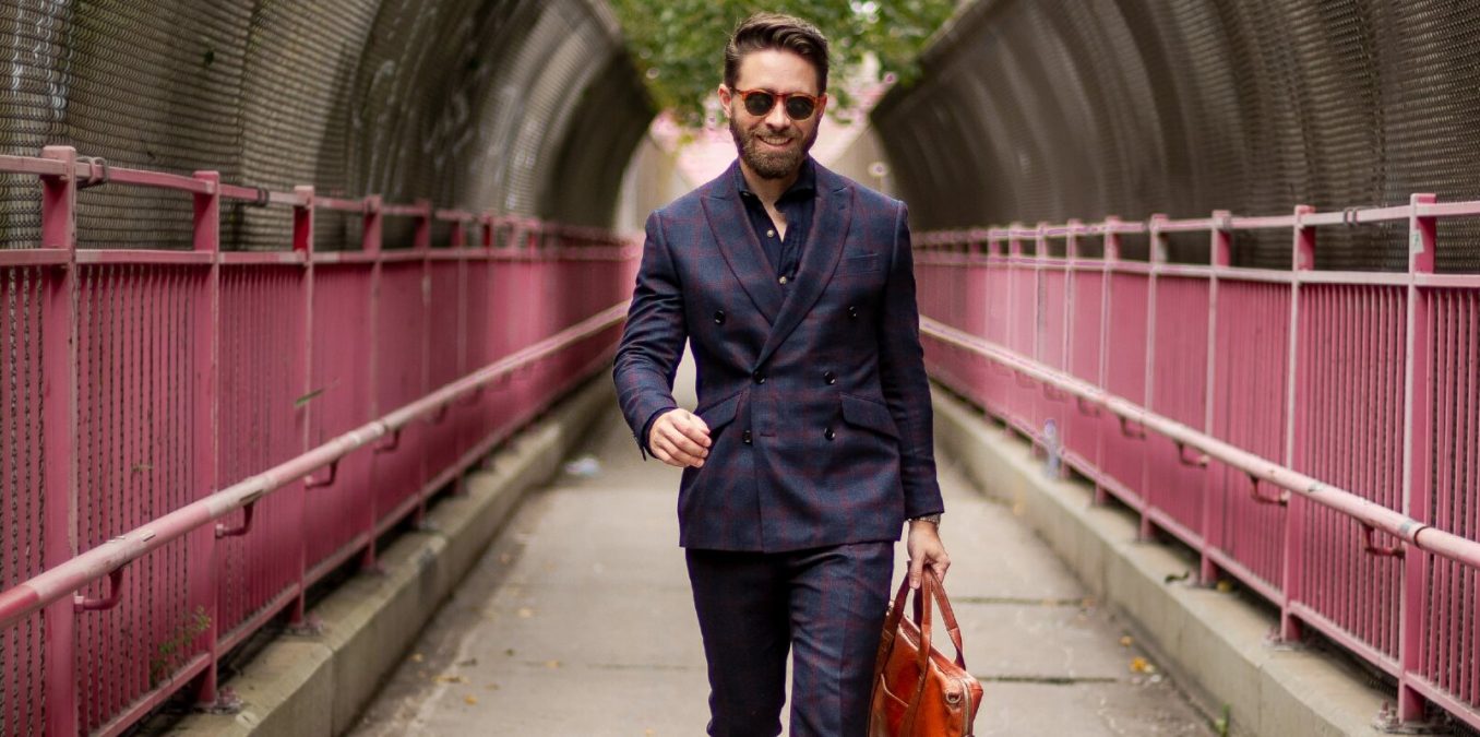 Businessman walking towards the camera on bridge