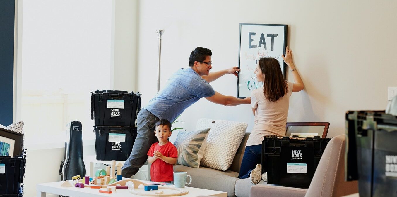 A couple unpacks boxes in their new home