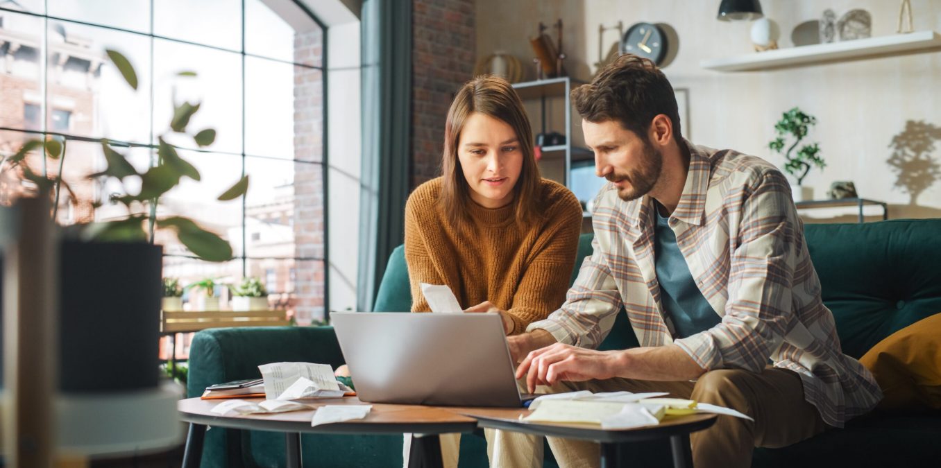 Stressful,Accounting,At,Home:,Couple,Using,Laptop,Computer,,Sitting,On