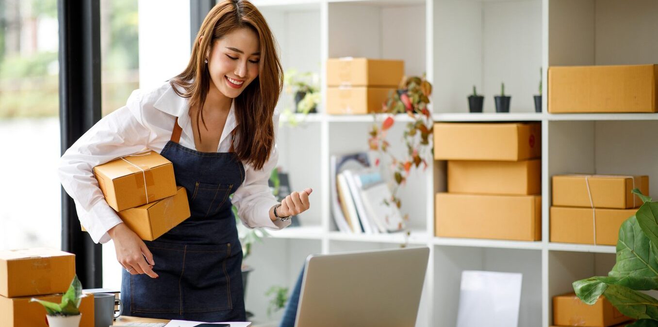 Female entrepreneur holding boxes