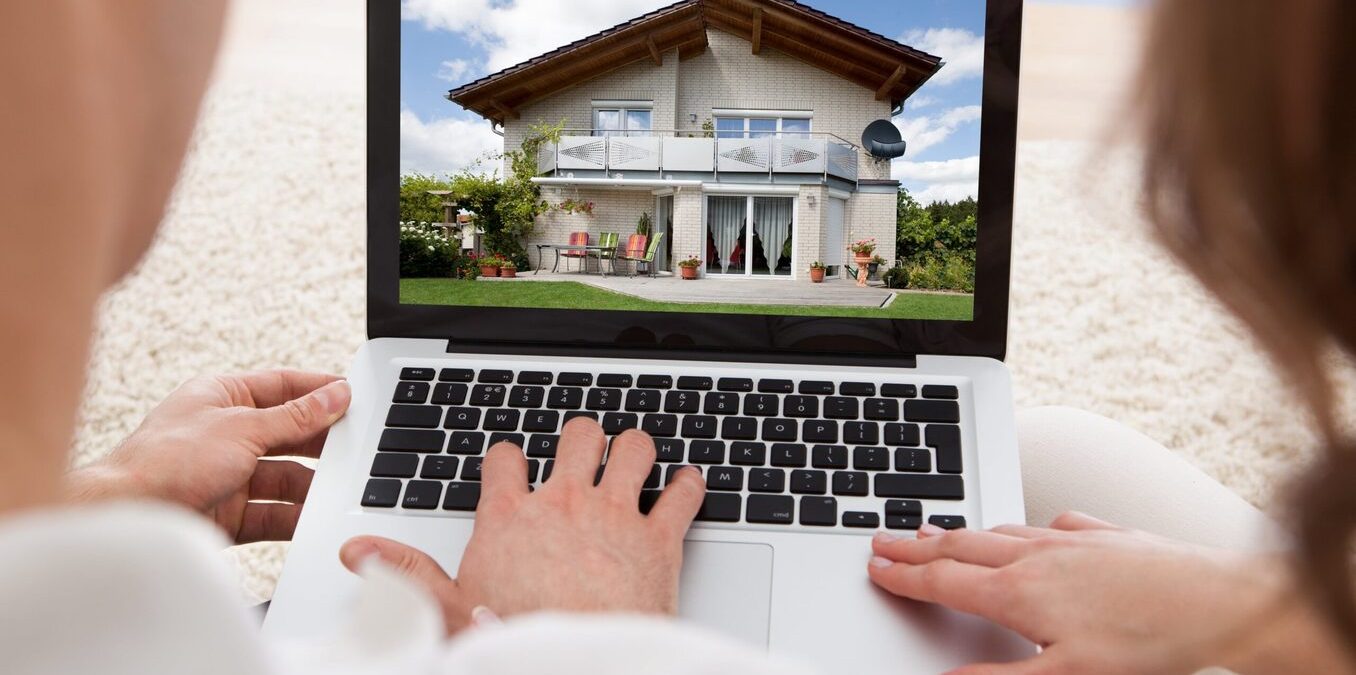 Home buying couple researching homes