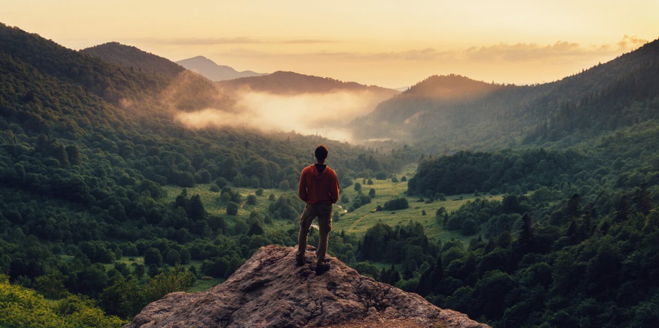 Man on top of a mountain