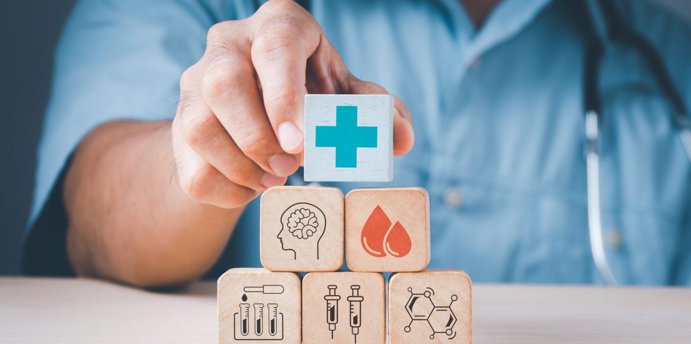 Doctor's,Hand,Stack,Woods,Block,Step,On,Table,With,Health