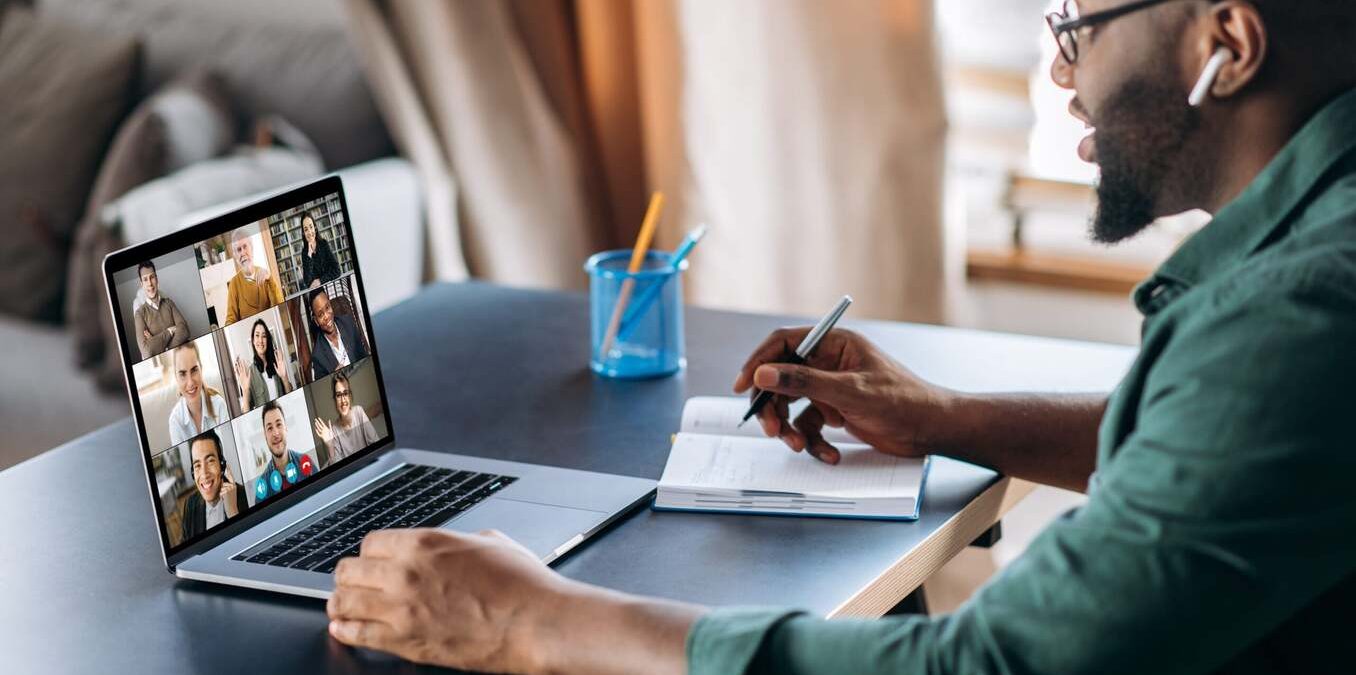 Man attending a virtual meeting on his laptop