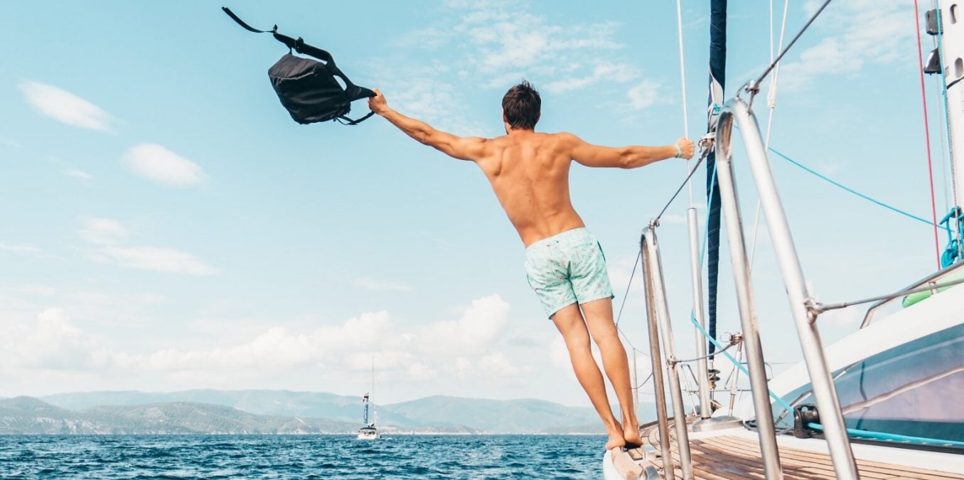 Man with a backpack on a boat