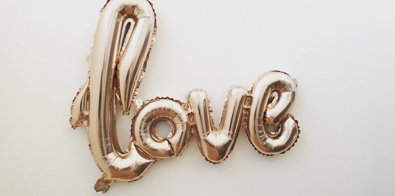 Gold balloons spelling LOVE.