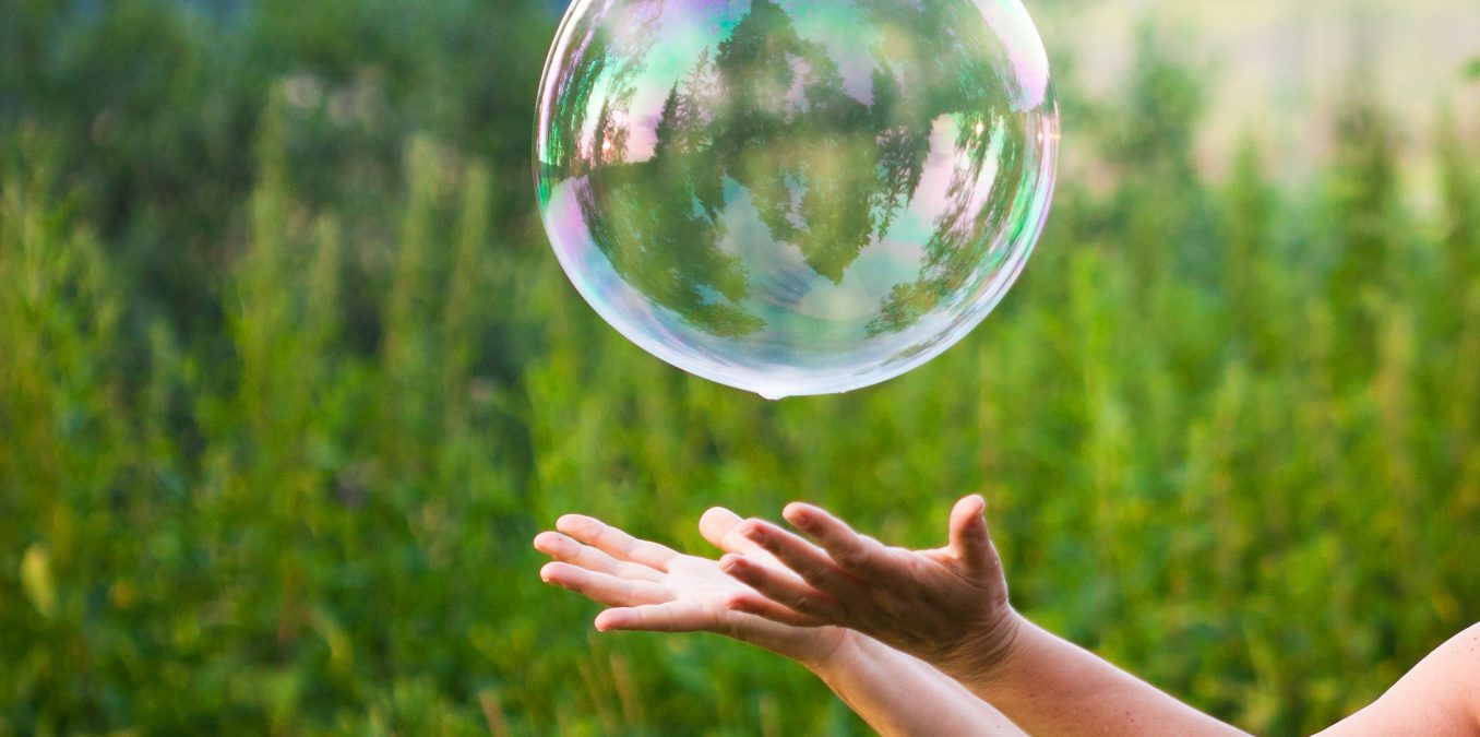 Hand,Catching,A,Soap,Bubble