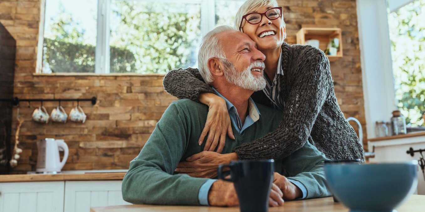 Mature woman hugging her husband