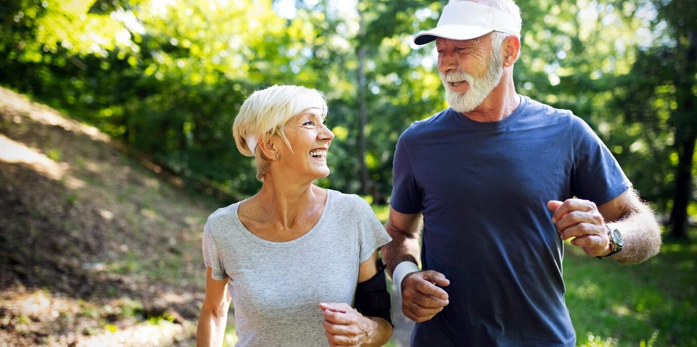 Senior couple jogging in nature