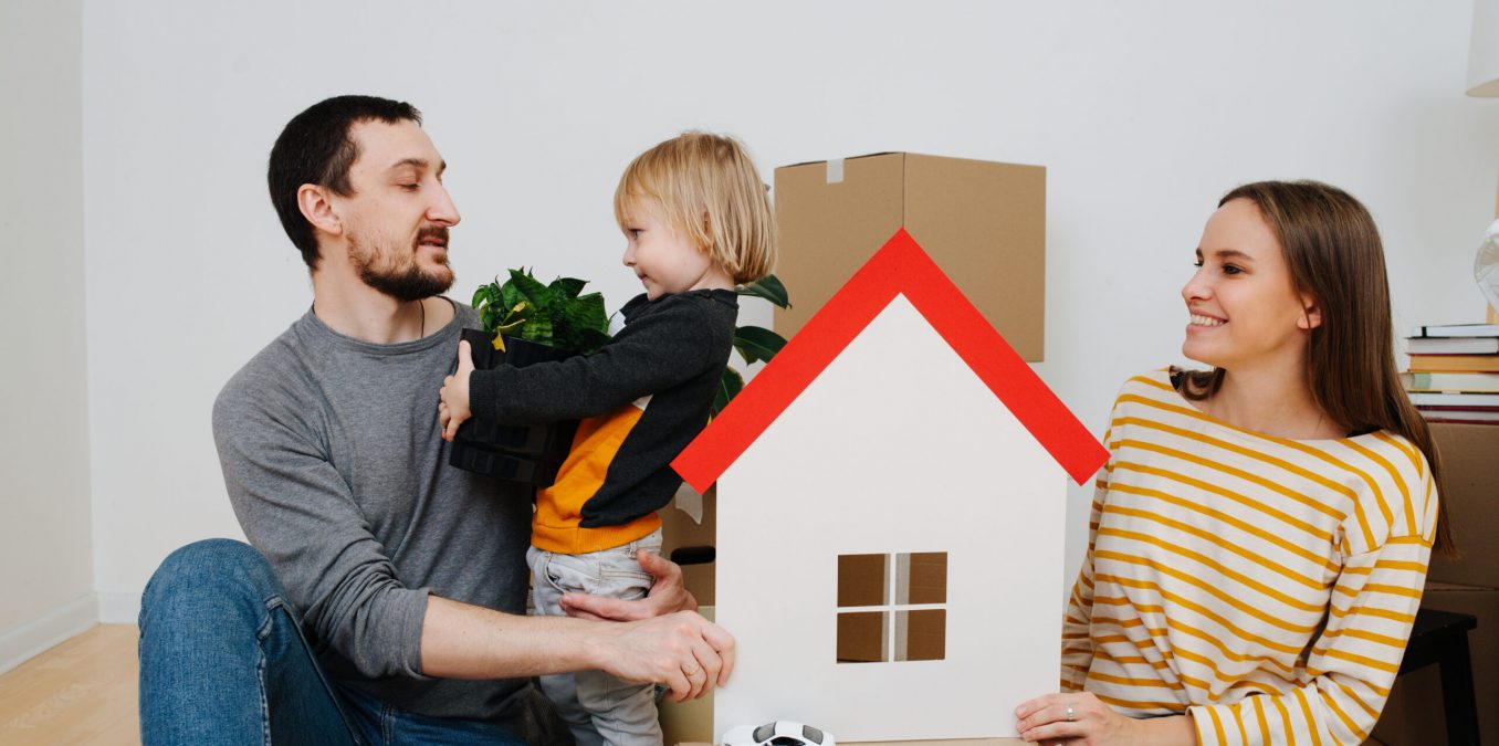 Family,Moved,Into,A,New,Apartment,,Parents,Looking,At,Their