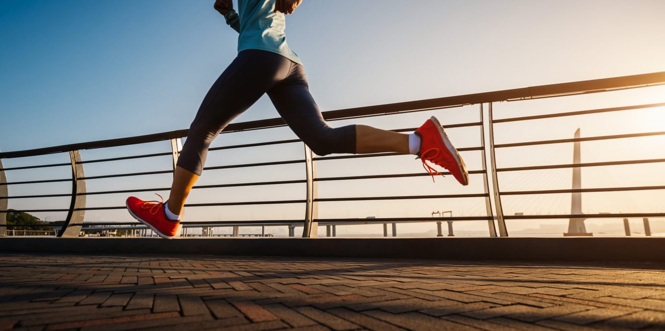 Fitness,Woman,Runner,Running,On,Seaside,Bridge