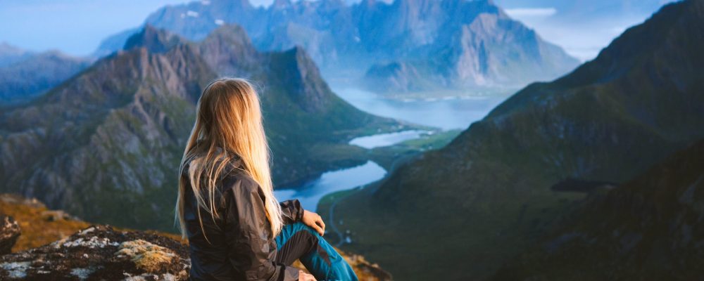 Solo,Traveler,Enjoying,Landscape,In,Norway,Lofoten,Islands,Aerial,View