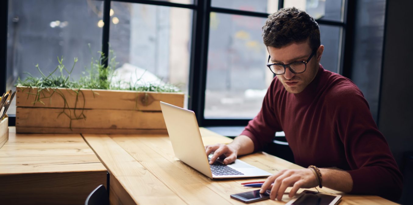 Confident,Busy,Male,Freelancer,In,Trendy,Eyewear,Doing,Remote,Job