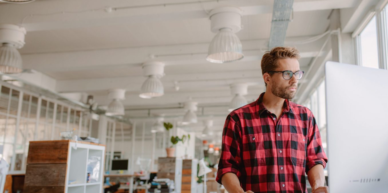 Shot,Of,Young,Businessman,In,Casual,Clothes,At,Modern,Startup