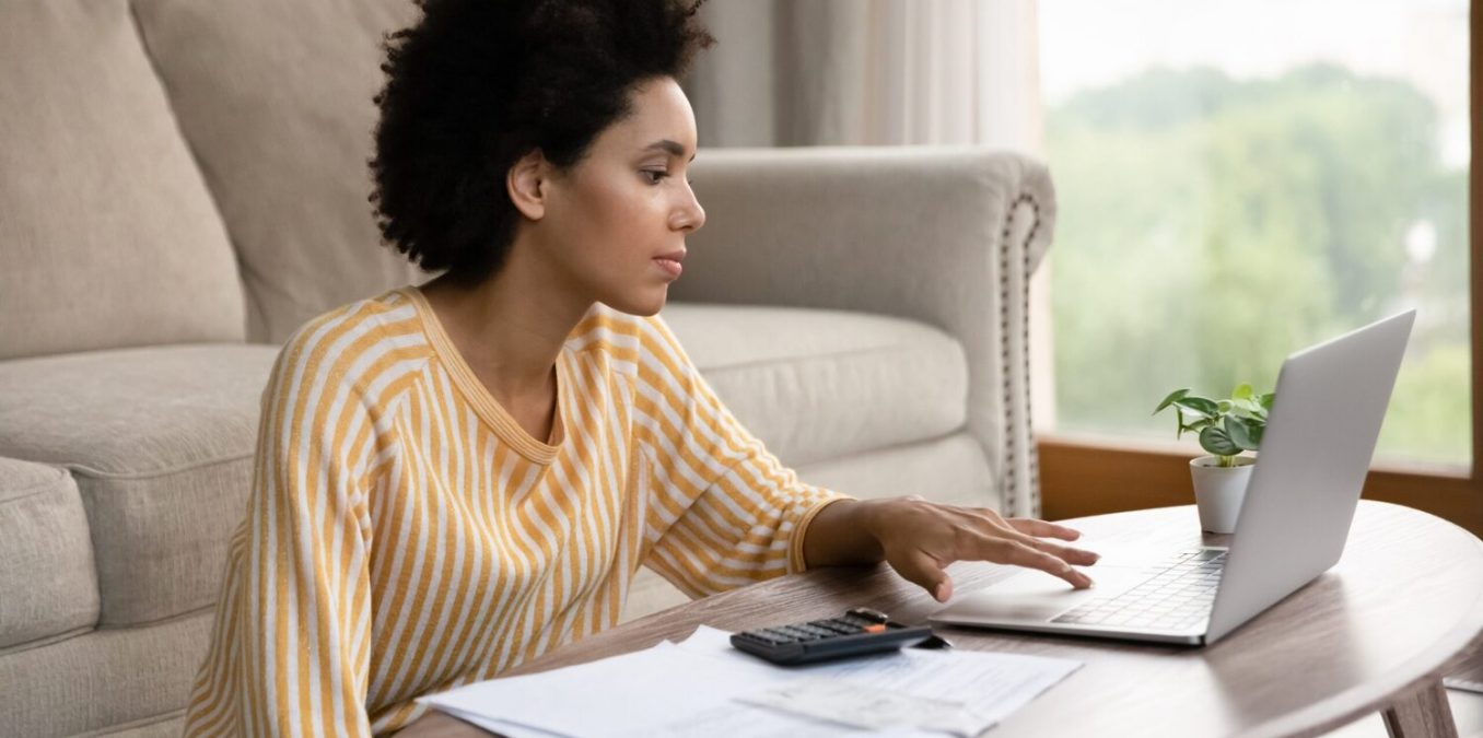 Woman using laptop at home