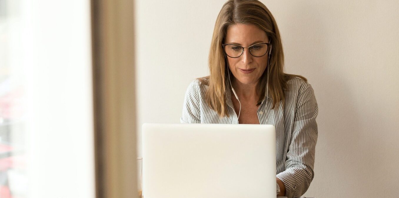 Woman working on laptop in an office